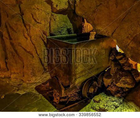 Old Vintage Mine Craft In A Mineshaft, Nostalgic Mining Equipment And Transportation