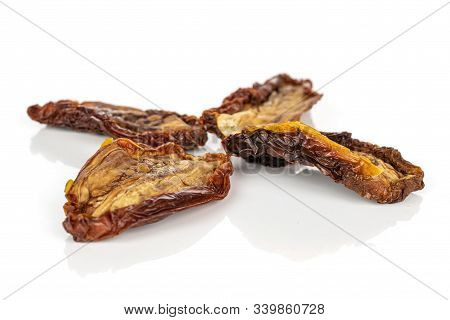 Group Of Four Whole Arranged Dried Red Tomato Piece Isolated On White Background