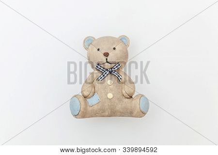 Simply Minimal Design With Toy Bear Isolated On White Background. Children Care Materinity Family Co