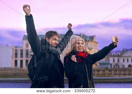 Happy Tourists Taking Photo Of Themselves. Holidays, Travel, Vacation, Tourism And Dating Concept. W