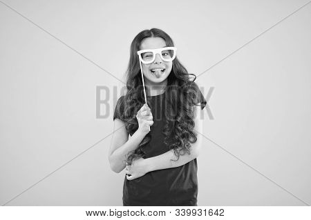 Funny Small Girl Holding Glasses Photo Booth Props On Stick. Cute Kid With Fancy Party Props. Party 
