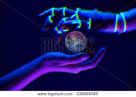 Earth Between Woman And Robots Hands As Symbol Of Partnership Between People And Technology For Save