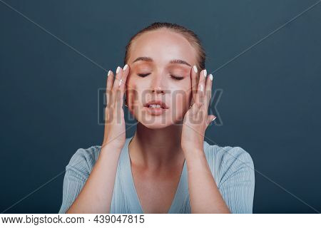 Millenial Young Woman Blonde Hair Portrait Doing Face Yoga Self Facebuilding Massage For Face Skin.