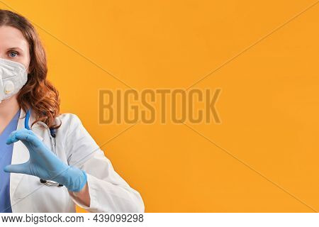 Hand Nurse In The Shape Of A Helf Heart. Doctor In Protective Pink Gloves And Medical Uniform, Close