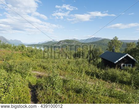 Mountain Lodge On The Shore Of Lake Lulealven, Lule River Dam In Saltoluokta In Birch Forest In Swed