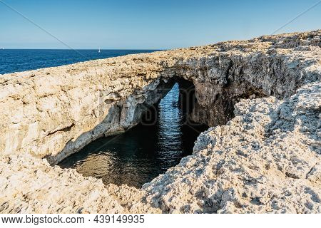 Ahrax Fallen Cave,malta.hole In The Middle Of Rocks With Crystal Clear Water Inside.rocky Maltese Co