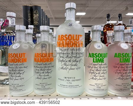 A Display Of Bottles Of  Flavored Absolut Vodka With Background Bokeh At A Binneys Liqour Store In S