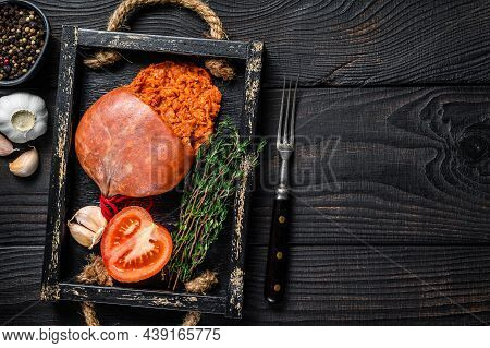 Mallorcan Sobrassada Cured Pork Meat Sausage In A Wooden Tray. Black Wooden Background. Top View. Co