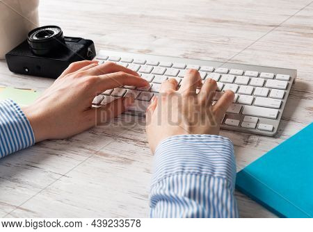 Freelancer Sitting At Desk And Typing On Wireless Keyboard. Business Occupation And Innovation Techn