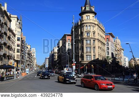 Barcelona, Spain - October 7, 2021: Traffic In Eixample District In Barcelona, Spain. Barcelona Is T