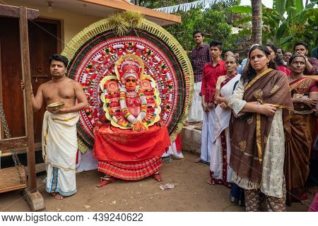 Payyanur, India - December 5, 2019: Theyyam artist perform during Theyyam temple festival in Payyanur, Kerala, India. Theyyam is a popular ritual form of worship in Kerala, India