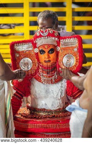 Payyanur, India - December 4, 2019: Theyyam artist preparing for Theyyam temple celebration in Payyanur, Kerala, India Theyyam is a popular ritual form of worship in Kerala, India