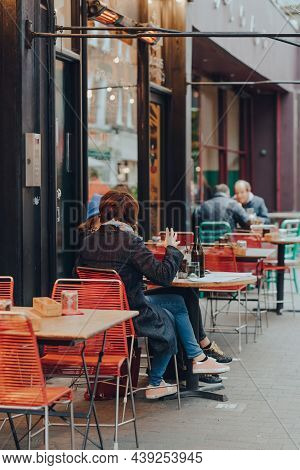 London, Uk - October 23, 2021: Women Chatting At The Outdoor Tables Of A Restaurant In Exmouth Marke