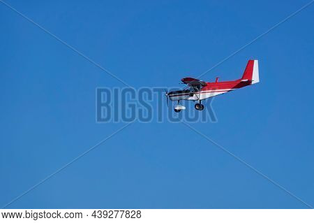 A Small Sports Plane In Flight. Copy Space.