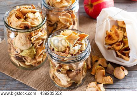 Homemade Sun-dried Organic Apple Slices, Crispy Apple Chips, On An Old Rustic Wooden Table With Fres