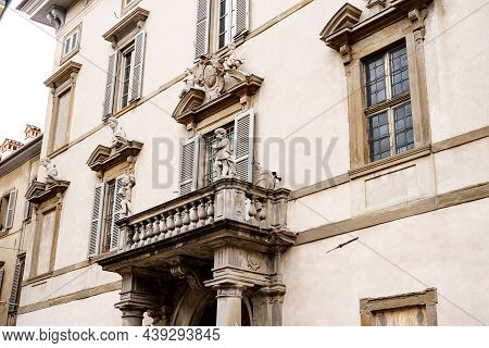 Statues Of Angels Above The Main Entrance To Palazzo Terzi. Bergamo, Italy