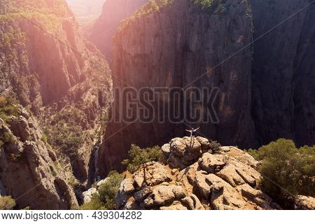 Man Traveler Standing On Cliff Of Tazi Canyon Turkey With Forest Aerial Top View Drone With Sunset. 