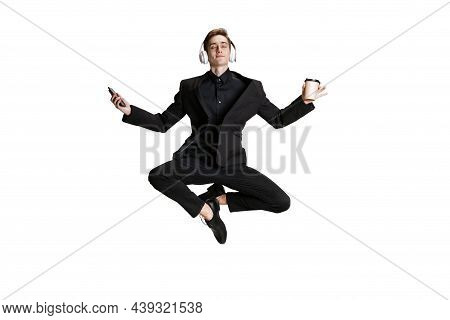 Young Man In Black Business Suit Dancing Isolated On White Background. Art, Motion, Action, Flexibil