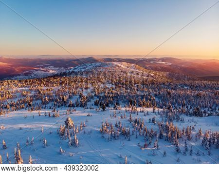 Colorful Winter Sunset In Sheregesh Ski Resort Mountains Covered Trees. Aerial Top View Beautiful Fo