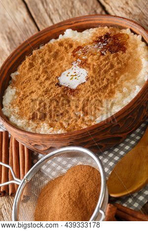 Rice Porridge Risengrod Or Risgrynsgrot With Sugar, Butter And Cinnamon Close Up In The Bowl On The 