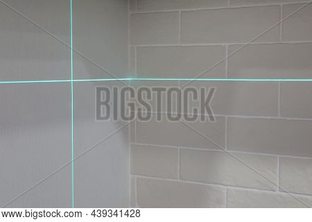 Cross Lines Of Laser Level On White Walls