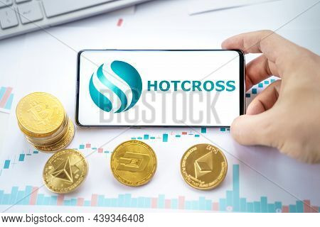 Russia Moscow 20.05.2021 Hotcross Logo In Mobile Phone.cryptocurrency Decentralized Exchange Dex.tra