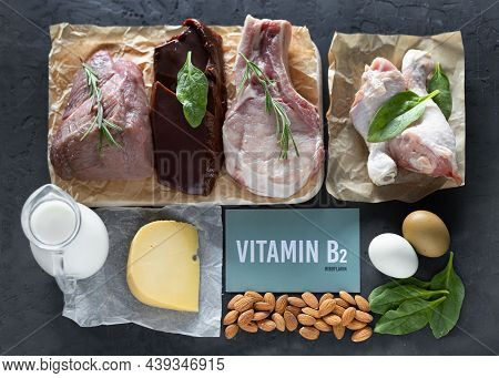 A Set Of Natural Products Rich In Vitamin B2 Riboflavin. Healthy Food Concept. Green Cardboard Sign 