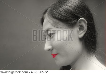 A Happy Chinese Woman Looking Away With Pink Heart Shaped Lips Within Chengdu China.