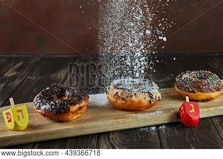 Happy Hanukkah And Hanukkah Sameach - Traditional Jewish Donuts, Spinning Tops With Pouring Powdered