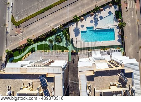 Aerial Drone Point Of View High Rise Residential Buildings With Swimming Pool, Well Groomed Inner Ya
