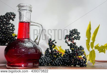 Healing Red Balm Made From Ripe Berries, Elderberries With Red Syrup. Homeopathy Copy Space.