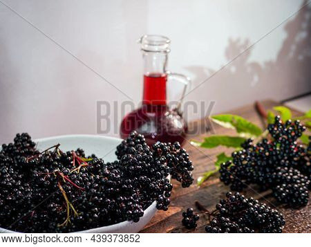 The Black Berry Is Medicinal. Ripe Elderberry Squeezed In Syrup In A Bottle. Natural Black Berry Jui