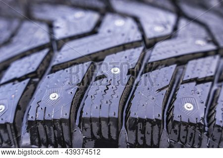 Winter Tires With Spikes On A Black Background Close-up, Safety During Winter Driving, Winter Tire P