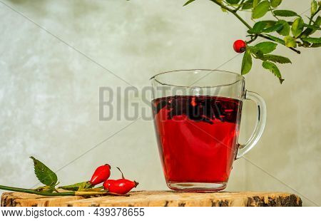 Antioxidant Mug With Rustic Red Rosehip Tea. Herbal Tincture Red Tea, Red Berry