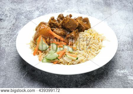 A Plate Of Masala Mutton Briyani On Rock Table.