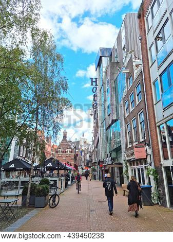 Amsterdam, The Netherlands - 04 October, 2021: People Walking In The Nieuwezijds Voorburgwal Street.