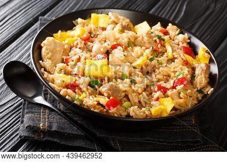 Peruvian Fusion Food Arroz Chaufa Fried Rice With Meat And Eggs Close Up In The Bowl On The Table. H