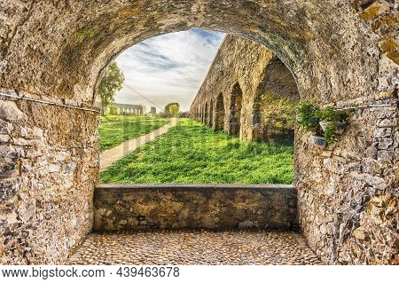 Scenic Rock Arch Balcony Overlooking The Iconic Ruins Of Parco Degli Acquedotti, Rome, Italy