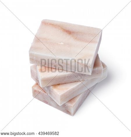 Pieces of frozen Pollock fish fillet as an ingredient for cooking close up isolated on white background