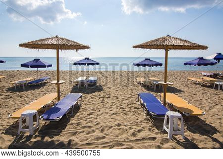 Umbrellas And Sunbeds On Tsampika Beach, Rhodes Island, Greece