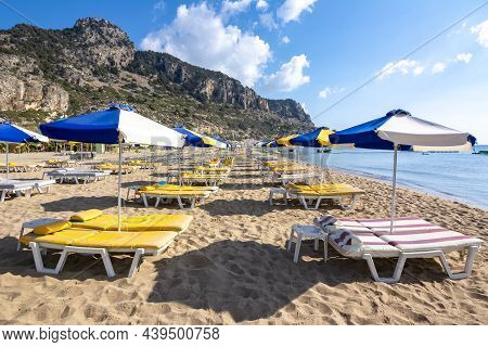 Umbrellas And Sunbeds On Tsampika Beach, Rhodes Island, Greece