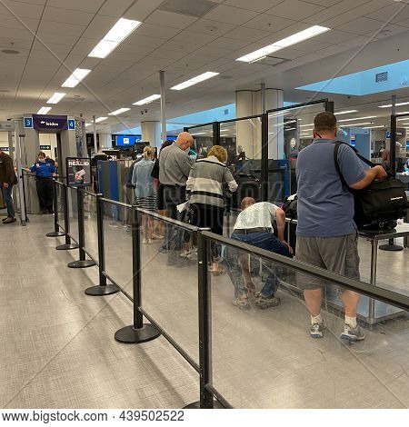 People Walking Through The Security Line At Orlando International Airport Mco.