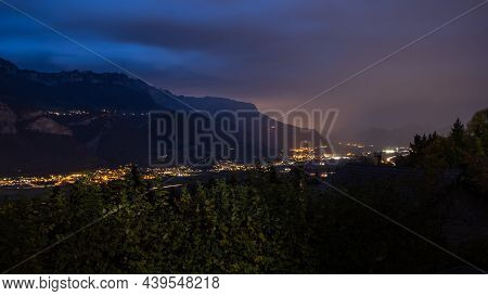 Landscape Of The Chartreuse Mountains By Night With The Plain Under Cloudy Sky