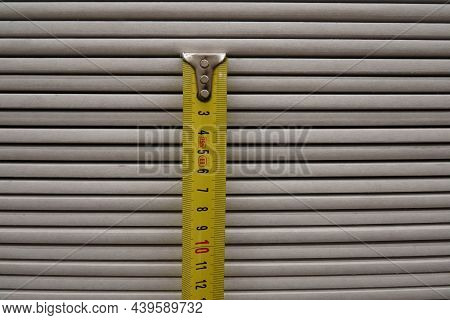 Photo Of A Yellow Measuring Tape In The Store.
