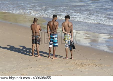 People On The Beach Of Ondina In Salvador, Bahia, Bathing In The Sea And Having Fun In The Middle Of