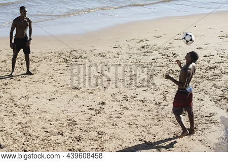 Salvador, Bahia, Brazil - January 08, 2020: Young People Playing Sand Football On The Beach Of Ondin