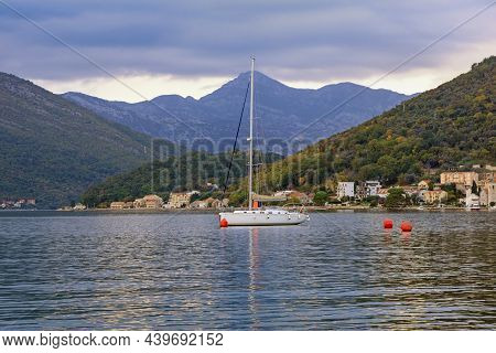 Overcast. Autumn Mediterranean Landscape. Sailboat On Water. Montenegro, Adriatic Sea. View Of Bay O