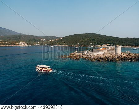 Ship Sailes Past The Island Of Otocic Gospa. Montenegro