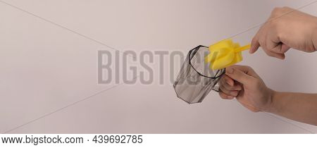 Clean And Wash Dish Concept. Man Hand Washing Drink Glass On White Background.