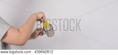 Clean And Wash Dish Concept. Man Hand Washing Drink Glass On White Background.